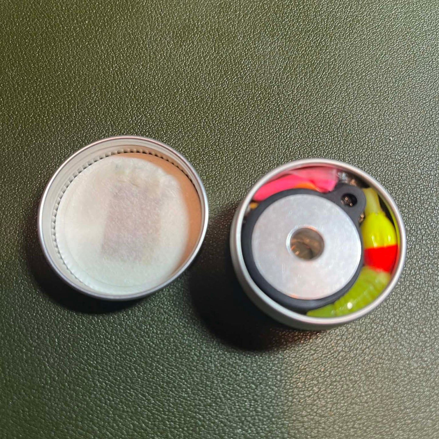 Open can packed tightly to the brim showing neatly arranged survival gear