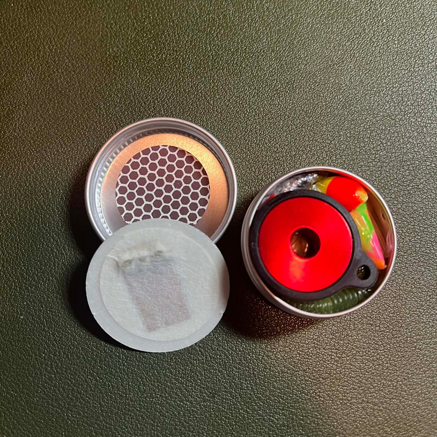 Open can showing neatly packed survival kit with matches stored in the lid